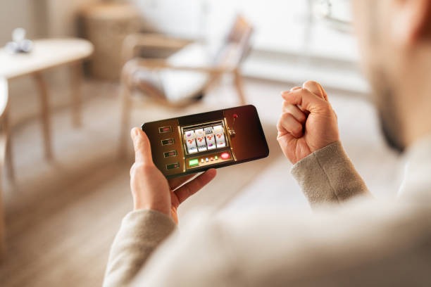 jutawan bet mobile app interface showing live dealer tables and sportsbook markets